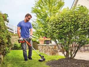 mowing lawn with string trimmer